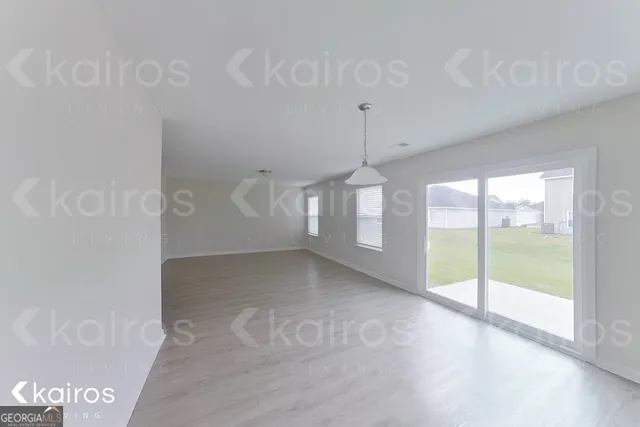 a view of empty room with windows