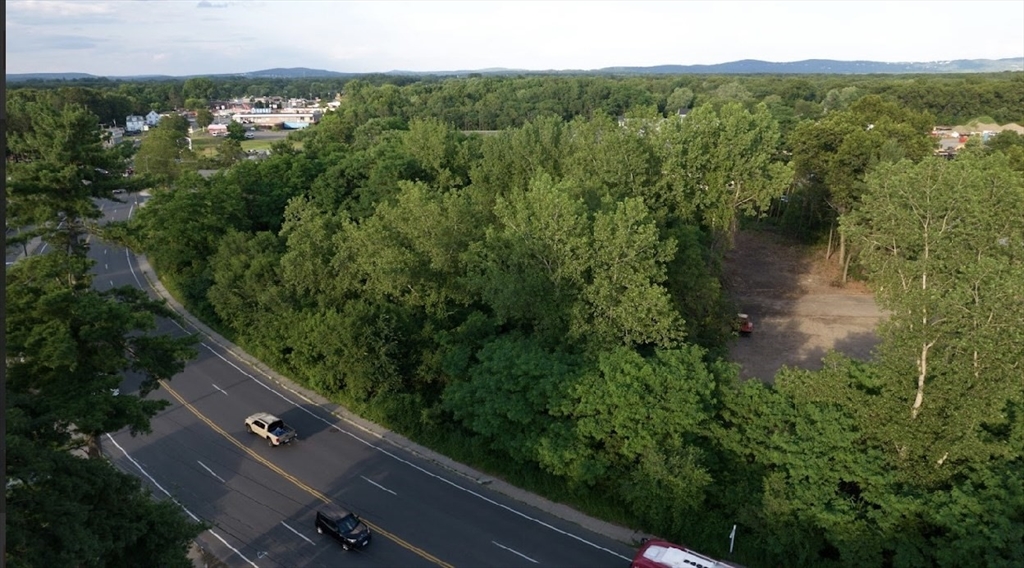 a view of a city from a balcony with outdoor space