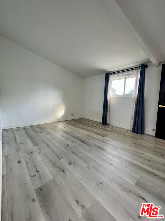 848 West Irving Place Anaheim, CA 92805 - Photo 15 of 33 an empty room with wooden floor and windows