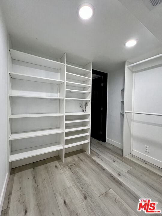 848 West Irving Place Anaheim, CA 92805 - Photo 18 of 33 a view of walk in closet with empty racks