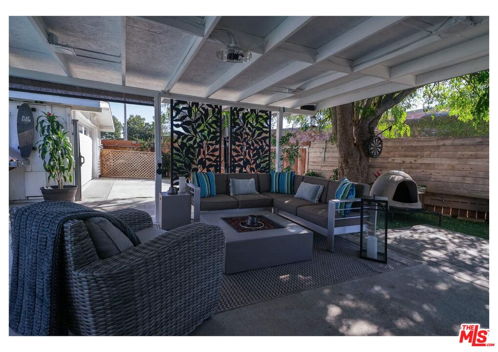 848 West Irving Place Anaheim, CA 92805 - Photo 29 of 33 a living room with furniture a table and a potted plant