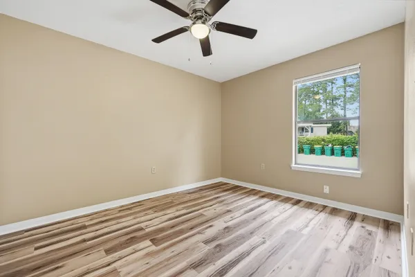 a view of room with window and ceiling fan