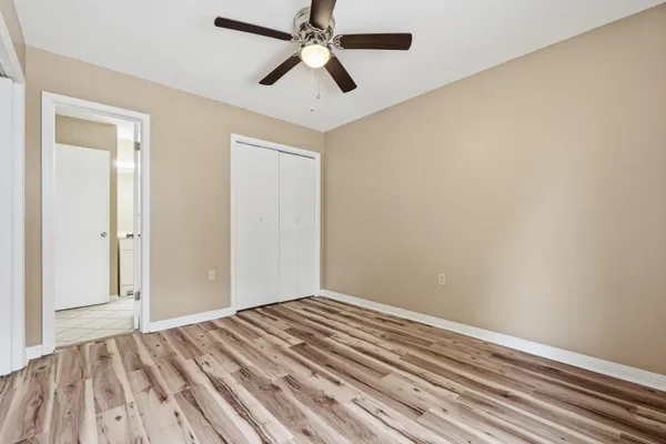 a view of a room with a ceiling fan