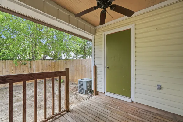 a view of a porch with wooden floor