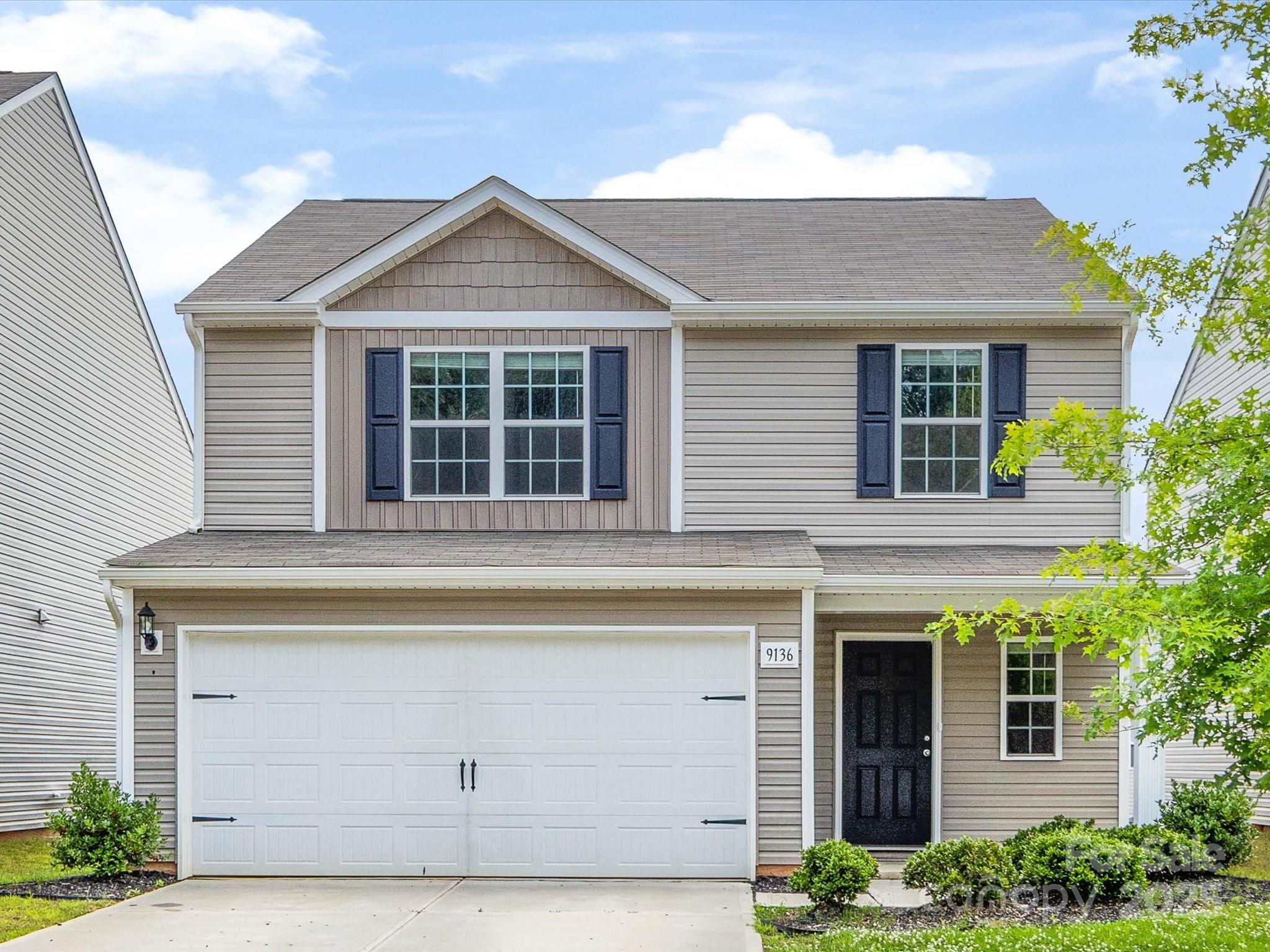 9136 Creedmore Hills Drive Charlotte, NC 28214 - Photo 1 of 48 a view of a house with a window and potted plants
