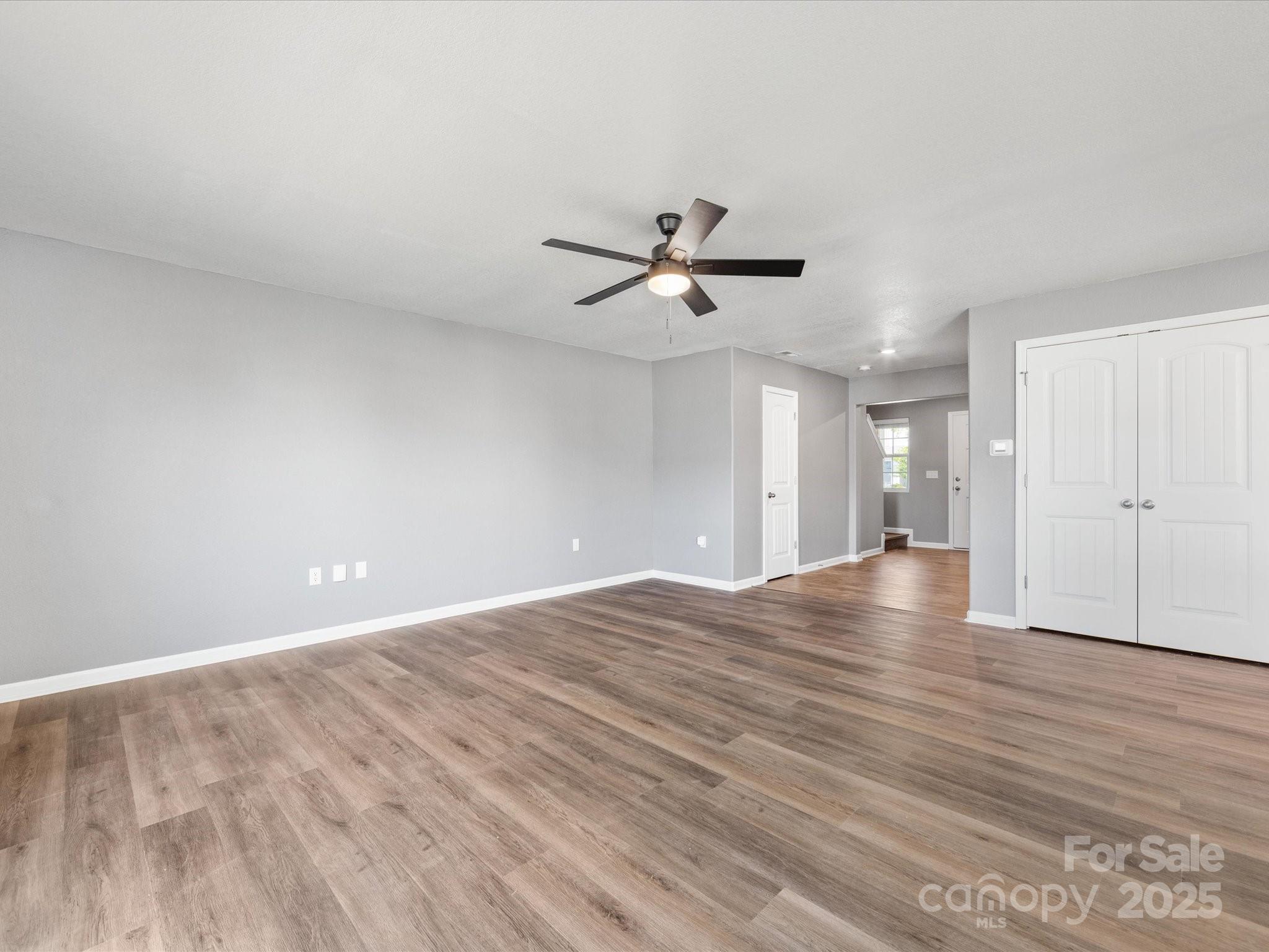 9136 Creedmore Hills Drive Charlotte, NC 28214 - Photo 11 of 48 a view of an empty room with wooden floor