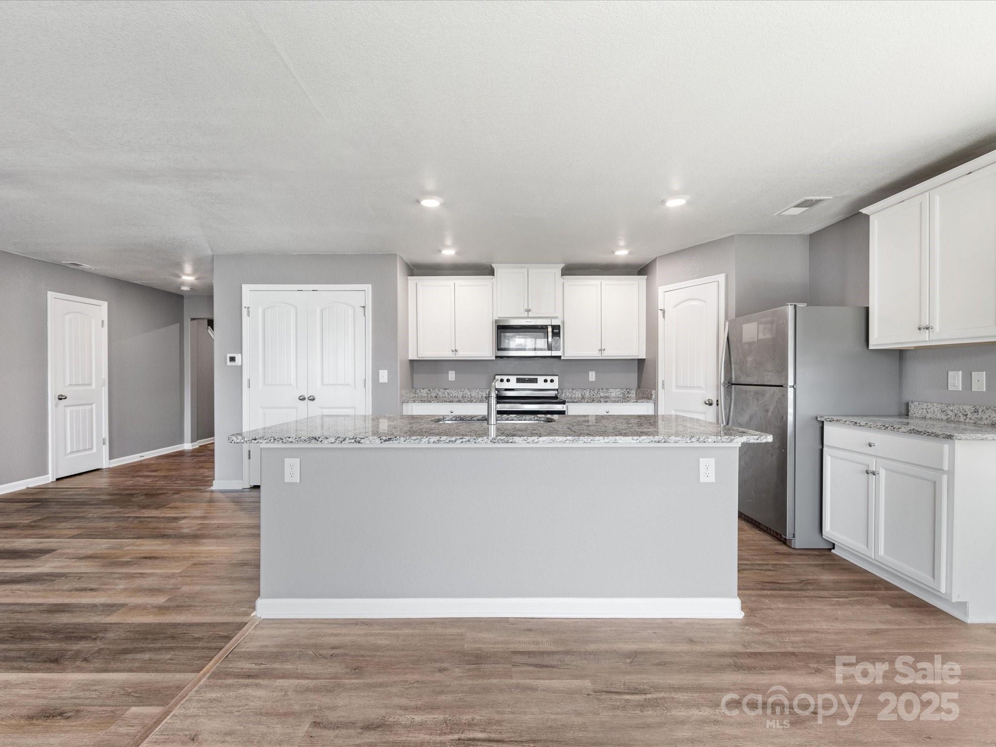 9136 Creedmore Hills Drive Charlotte, NC 28214 - Photo 14 of 48 a view of kitchen with wooden floor