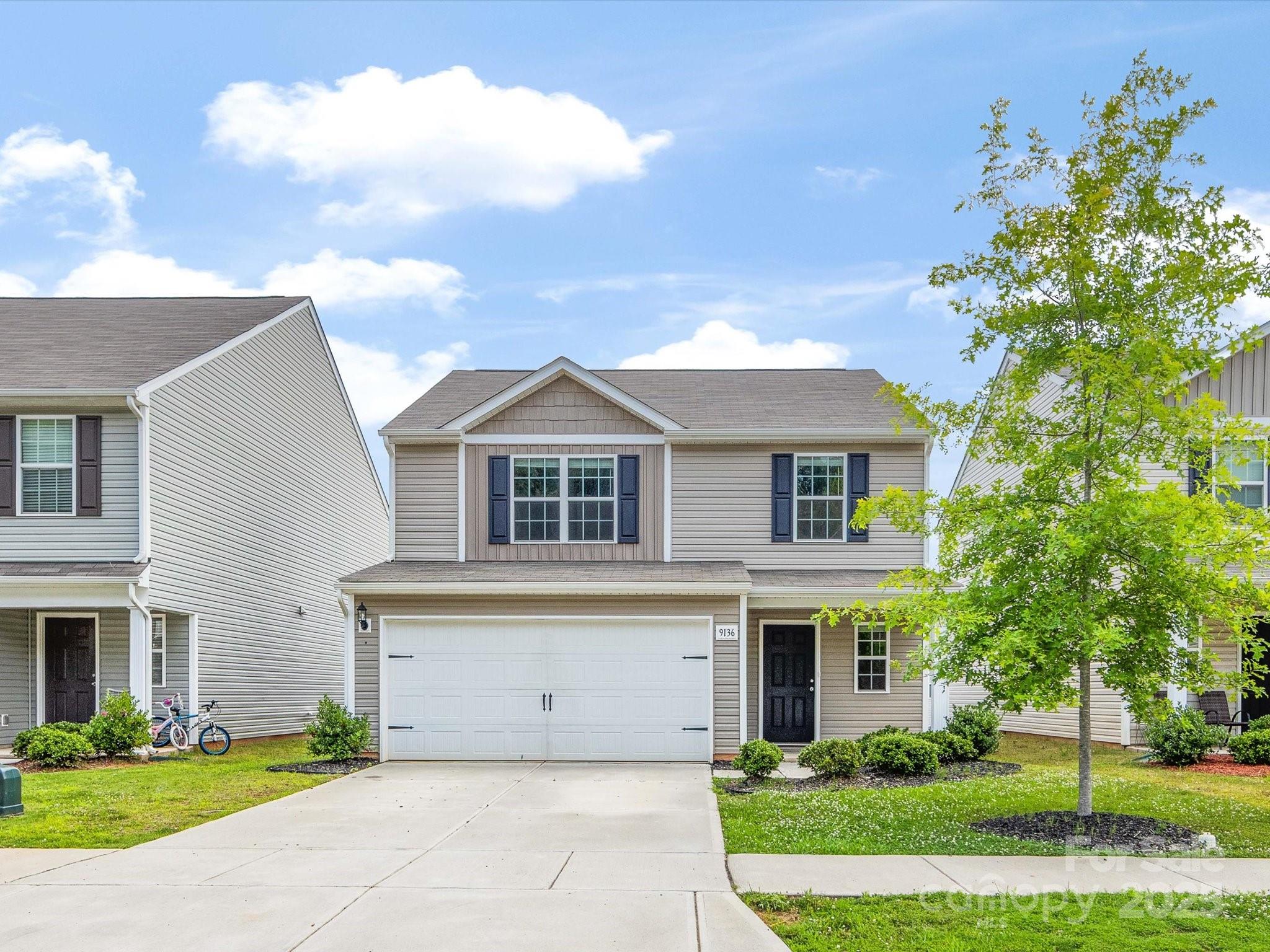 9136 Creedmore Hills Drive Charlotte, NC 28214 - Photo 2 of 48 a front view of a house with a yard