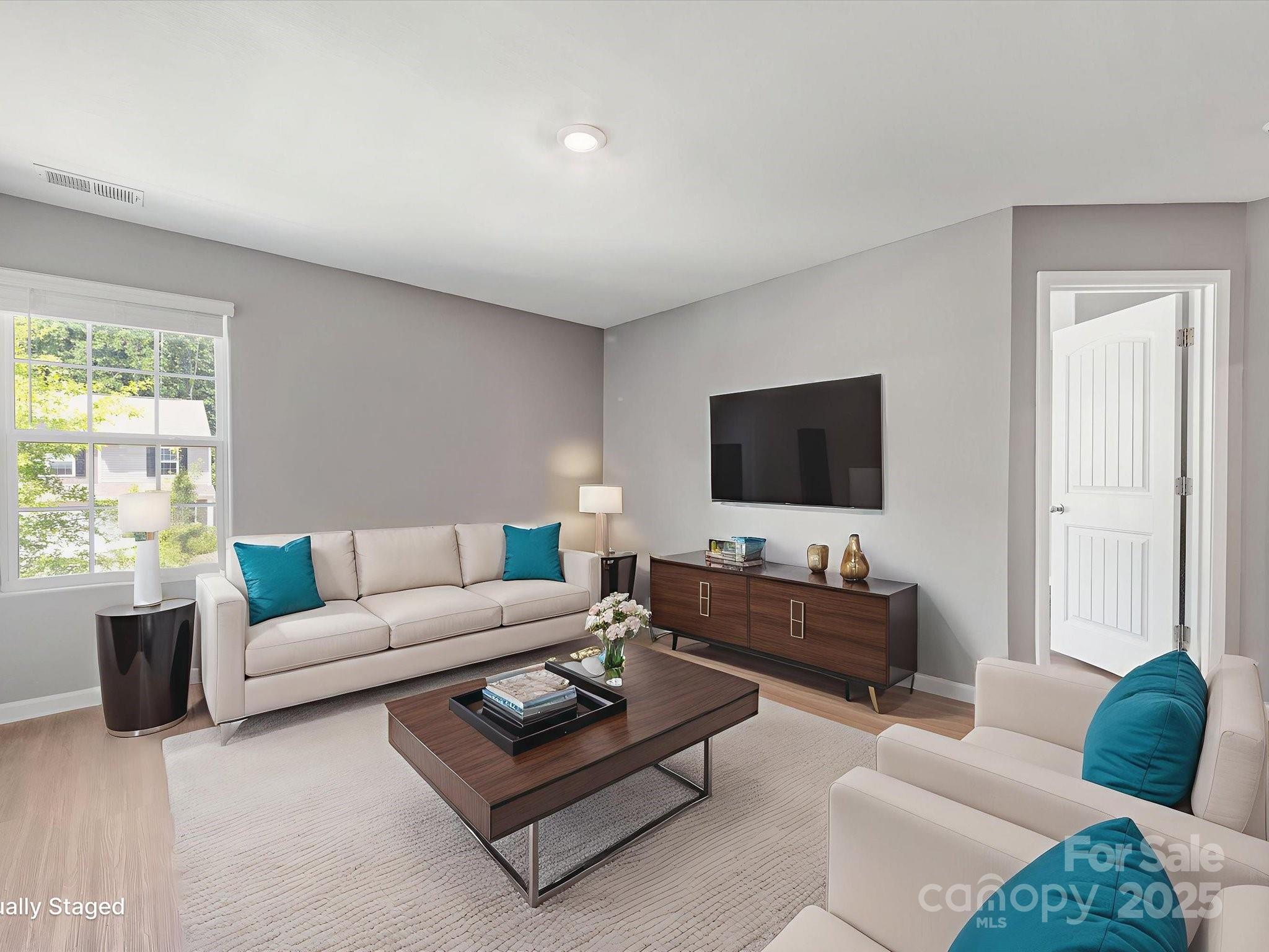 9136 Creedmore Hills Drive Charlotte, NC 28214 - Photo 22 of 48 a living room with furniture and a flat screen tv
