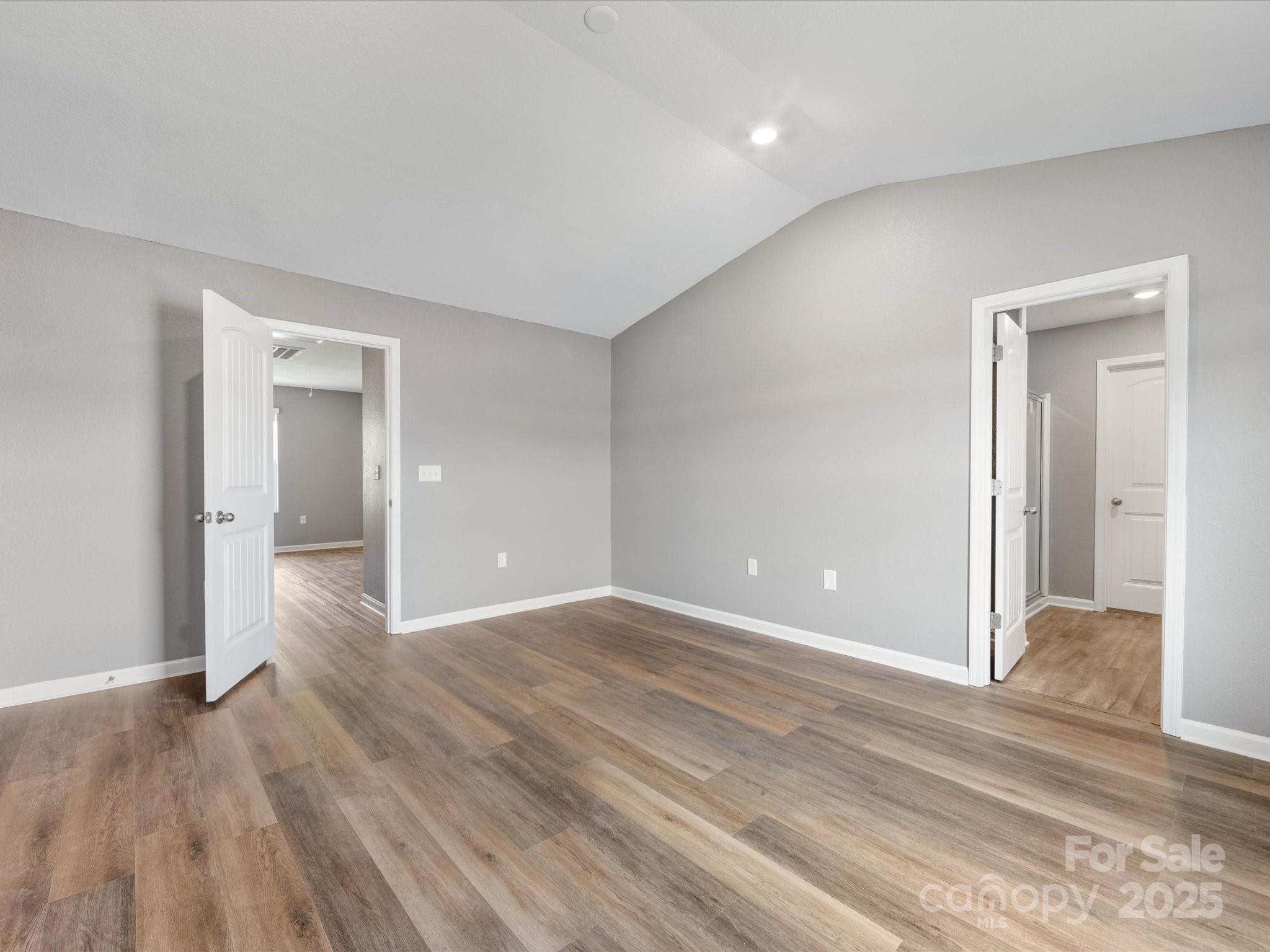 9136 Creedmore Hills Drive Charlotte, NC 28214 - Photo 32 of 48 a view of an empty room and wooden floor