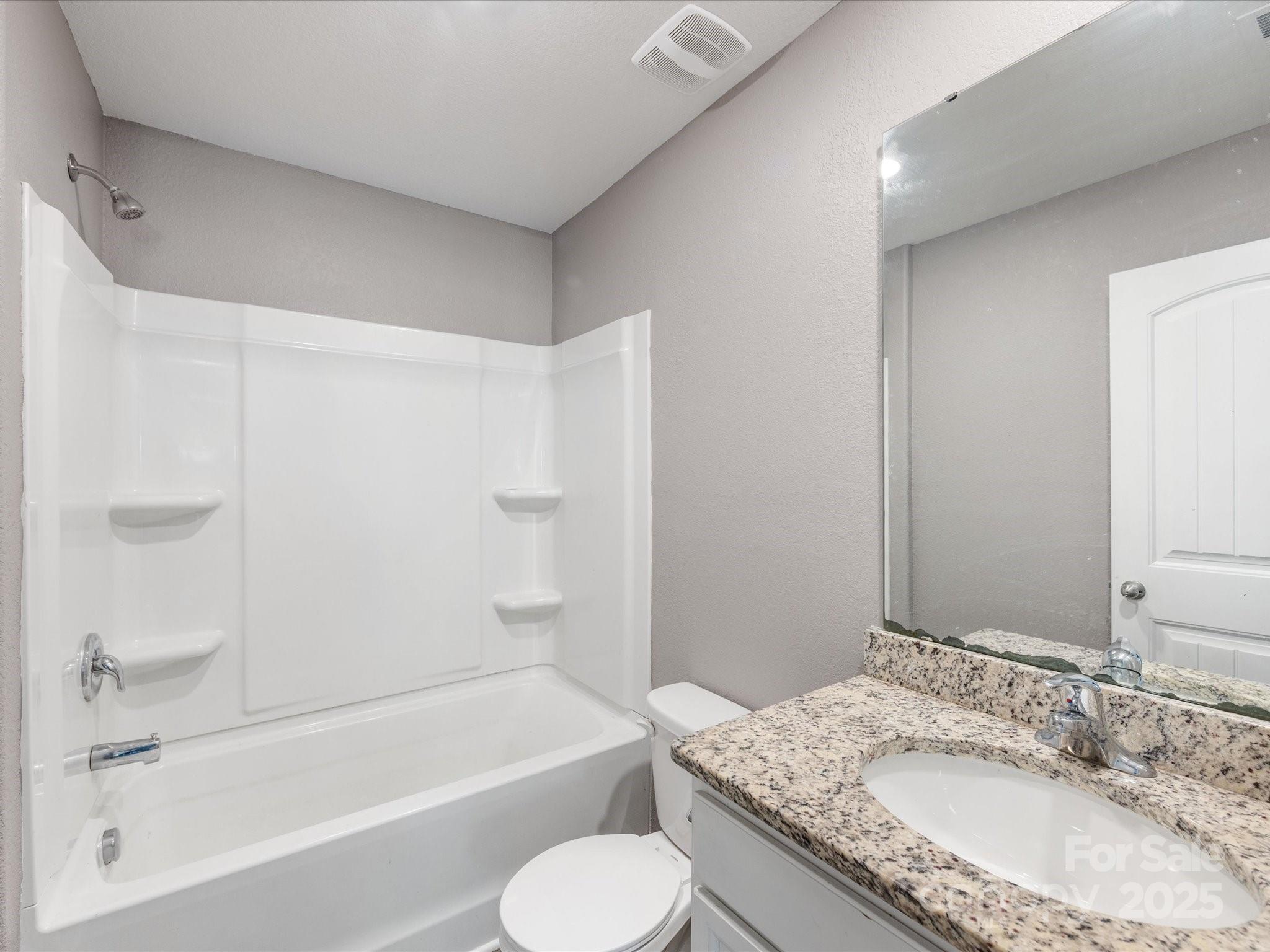 9136 Creedmore Hills Drive Charlotte, NC 28214 - Photo 40 of 48 a bathroom with a granite countertop sink toilet and bathtub