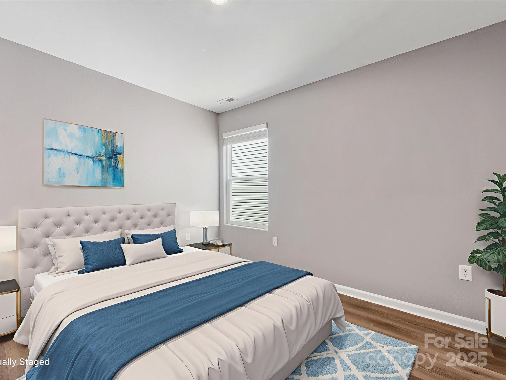 9136 Creedmore Hills Drive Charlotte, NC 28214 - Photo 41 of 48 a bedroom with a bed and a painting on the wall