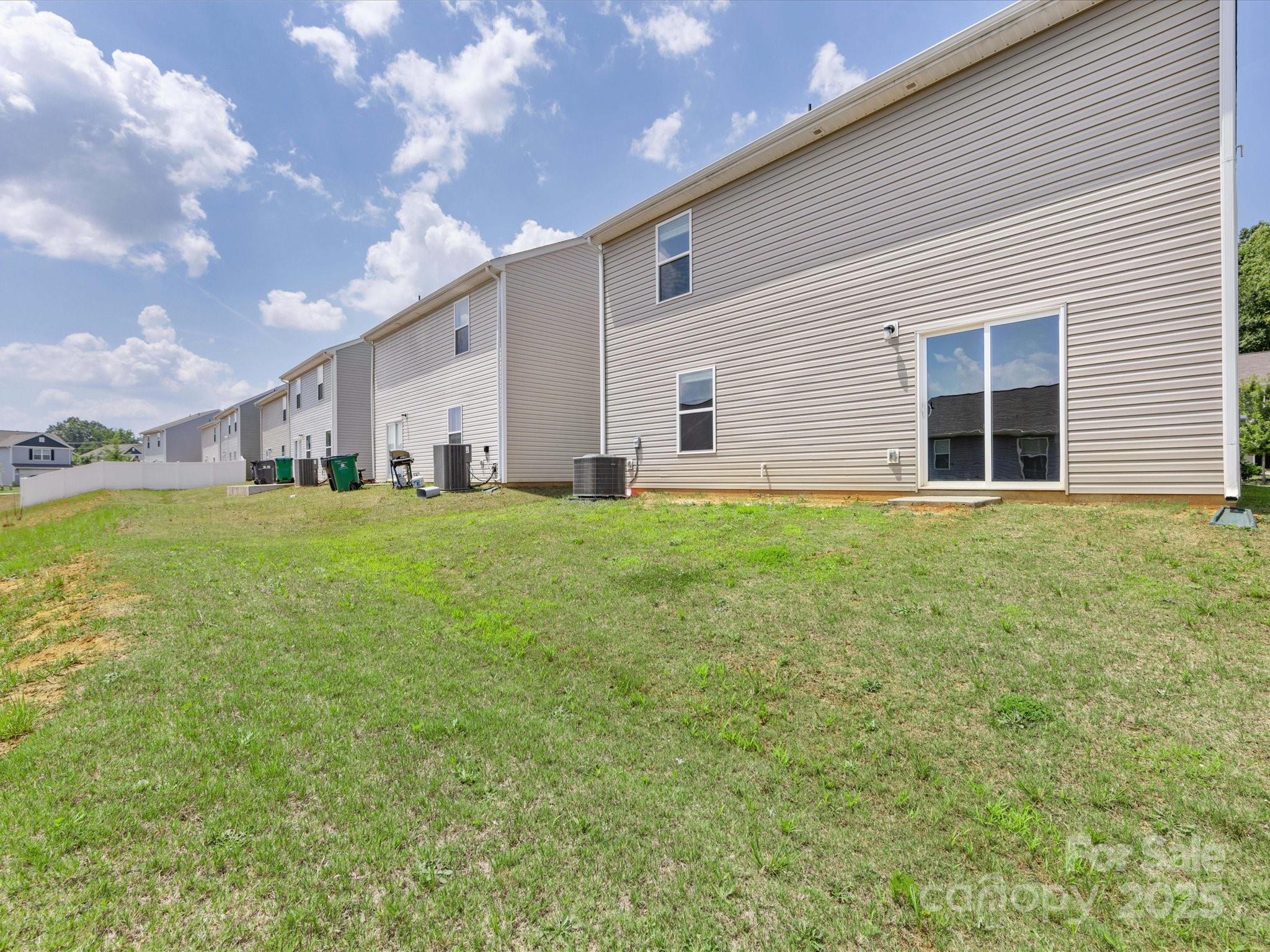 9136 Creedmore Hills Drive Charlotte, NC 28214 - Photo 47 of 48 a big room with yard and plants