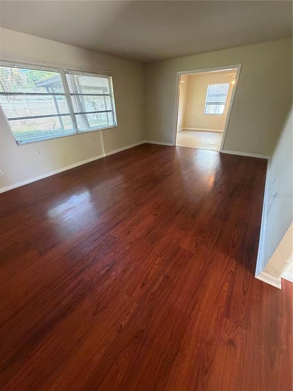 517 London Road Winter Park, FL 32792 - Photo 7 of 13 an empty room with wooden floor and windows