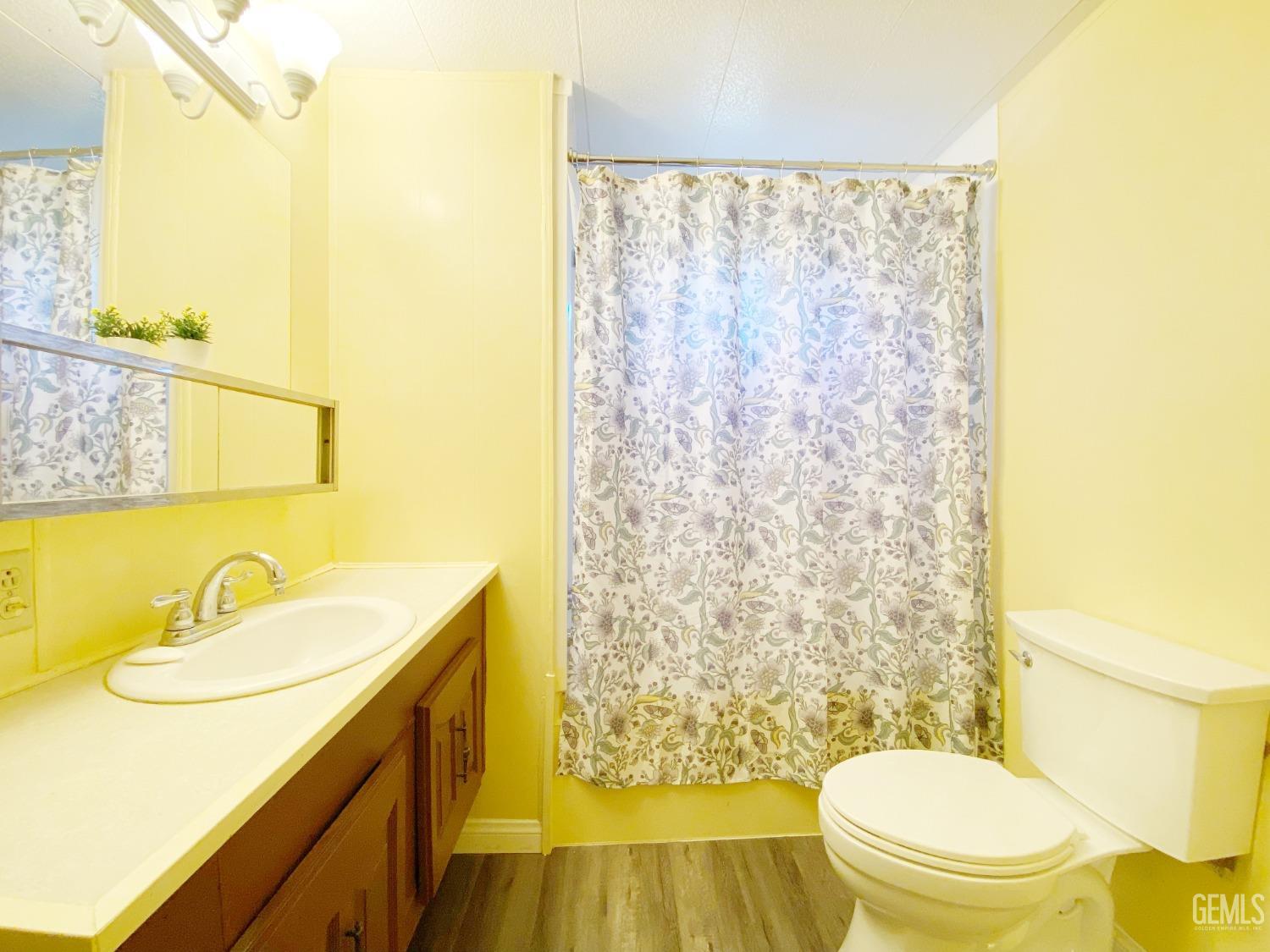 Undisclosed Address Bakersfield, CA 93301 - Photo 13 of 16 a bathroom with a sink and a mirror