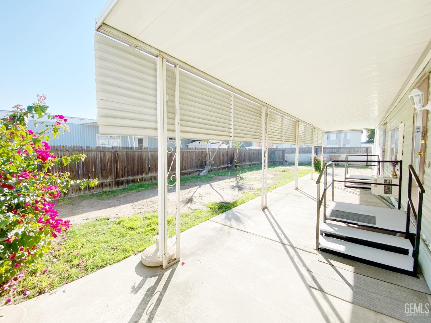 Undisclosed Address Bakersfield, CA 93301 - Photo 14 of 16 a view of a backyard with sitting area