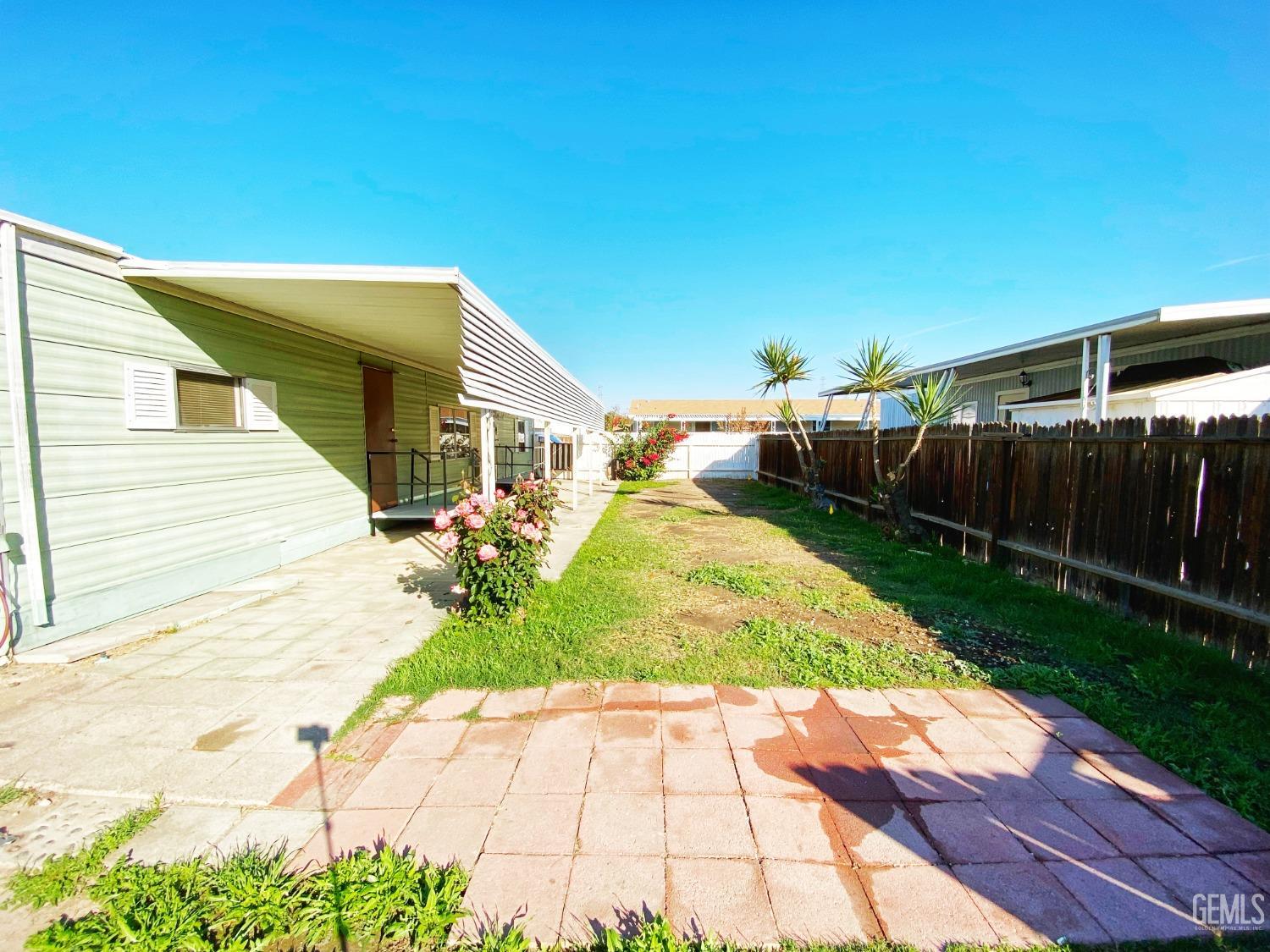 Undisclosed Address Bakersfield, CA 93301 - Photo 15 of 16 a view of a backyard of the house