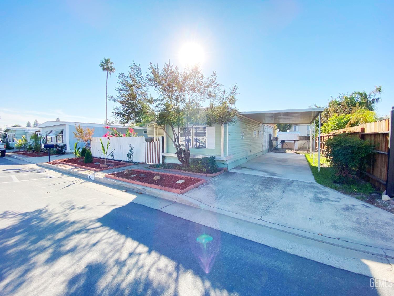 Undisclosed Address Bakersfield, CA 93301 - Photo 3 of 16 a outdoor space with lots of palm trees