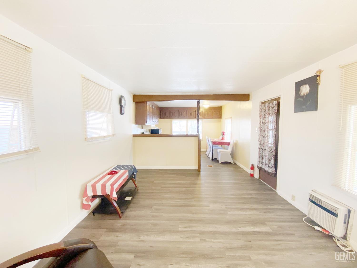 Undisclosed Address Bakersfield, CA 93301 - Photo 5 of 16 a room with a bed and a view of kitchen