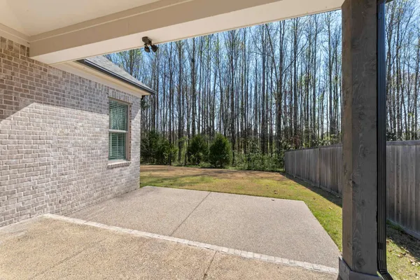 a view of swimming pool with wooden fence