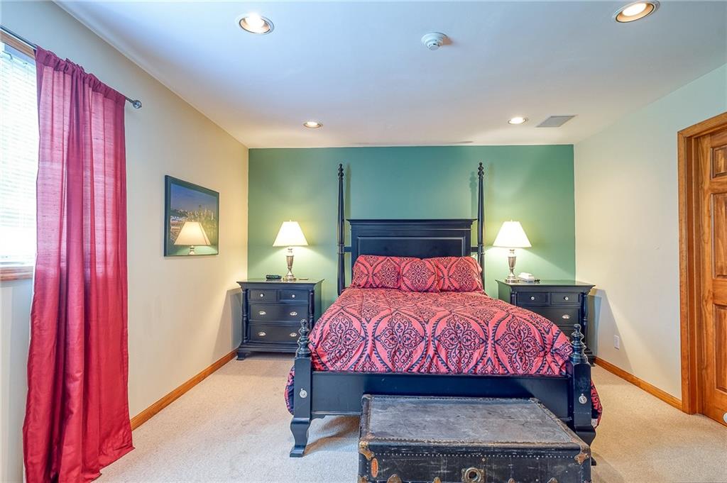 282 Alpine Heights Road Champion, PA 15622 - Photo 14 of 25 a bedroom with a bed and a mirror