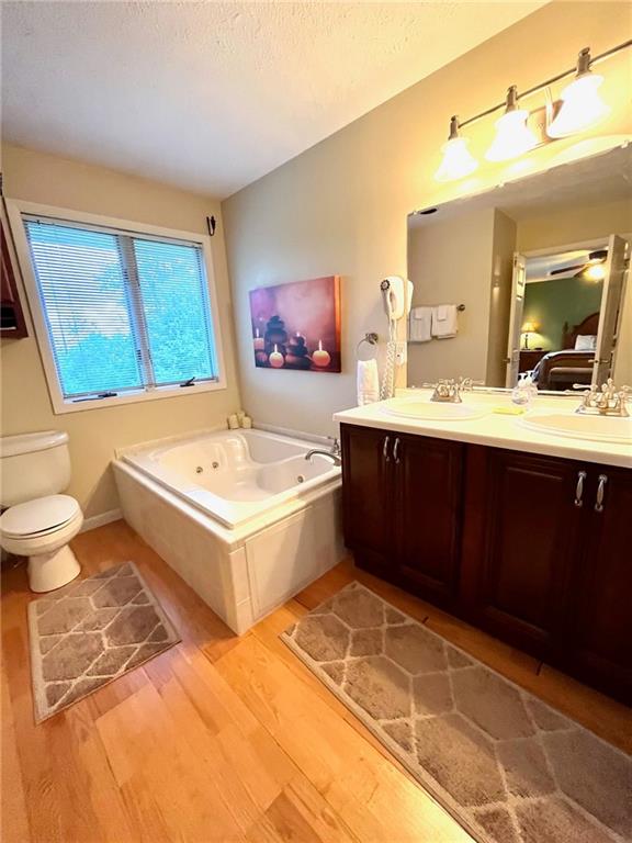 282 Alpine Heights Road Champion, PA 15622 - Photo 16 of 25 a bathroom with a tub sink and mirror