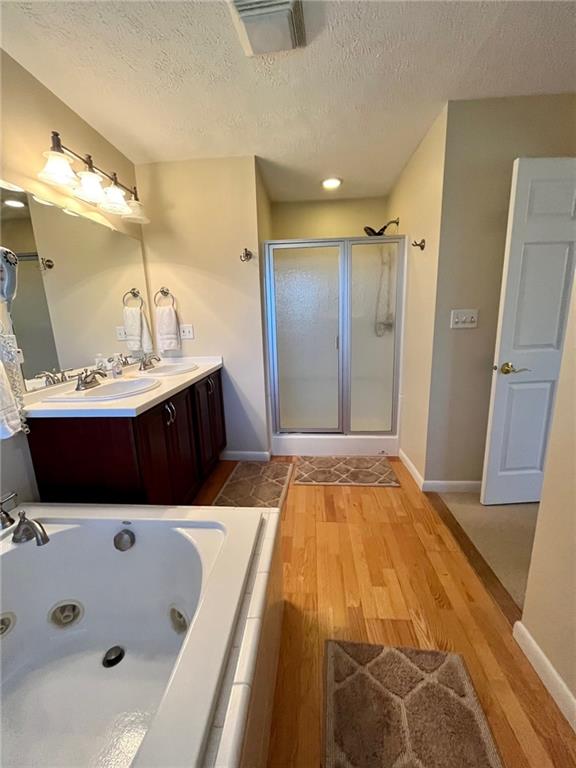 282 Alpine Heights Road Champion, PA 15622 - Photo 17 of 25 a bathroom with a tub sink and mirror