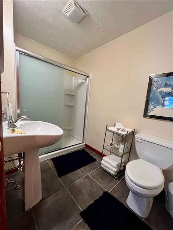 282 Alpine Heights Road Champion, PA 15622 - Photo 19 of 25 a bathroom with a sink mirror vanity and toilet