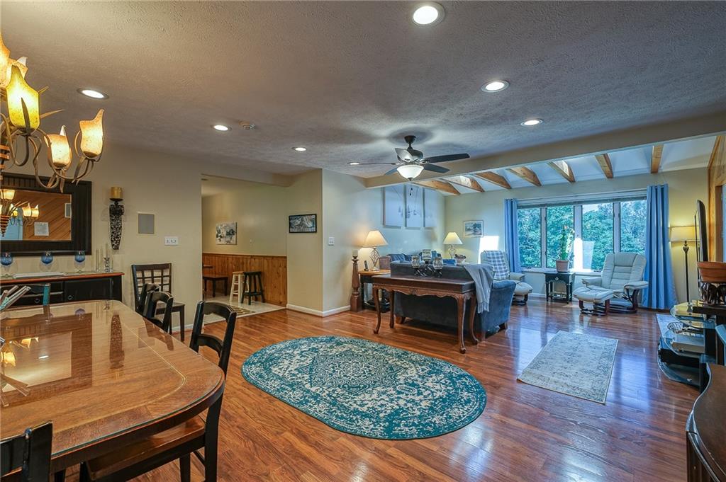 282 Alpine Heights Road Champion, PA 15622 - Photo 5 of 25 a living room with furniture a table and a fireplace