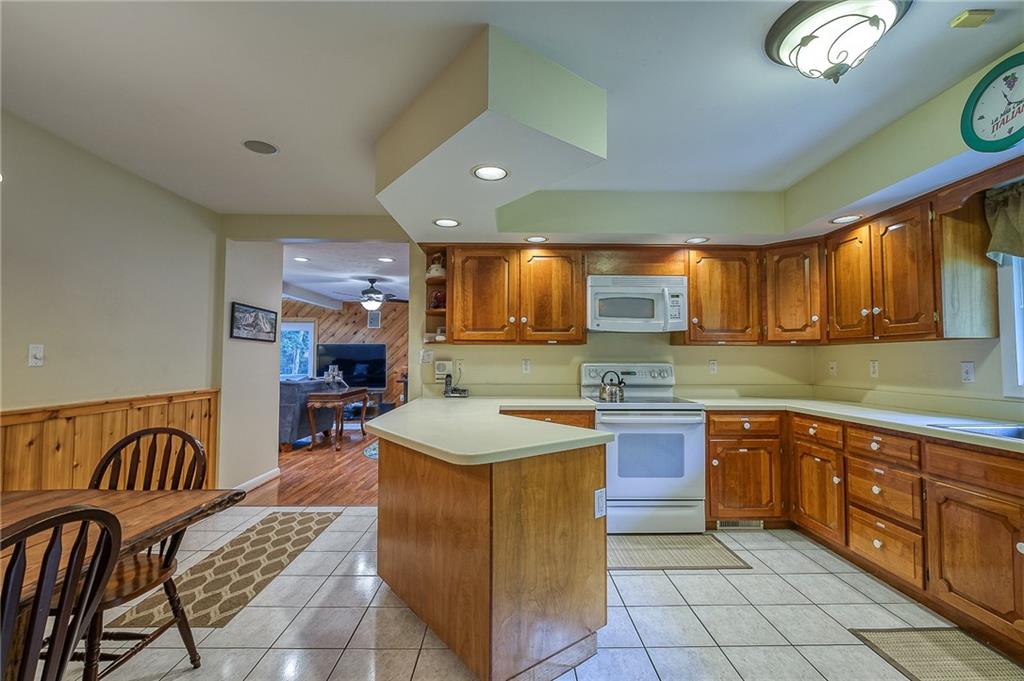 282 Alpine Heights Road Champion, PA 15622 - Photo 7 of 25 a kitchen with stainless steel appliances granite countertop a sink and a refrigerator
