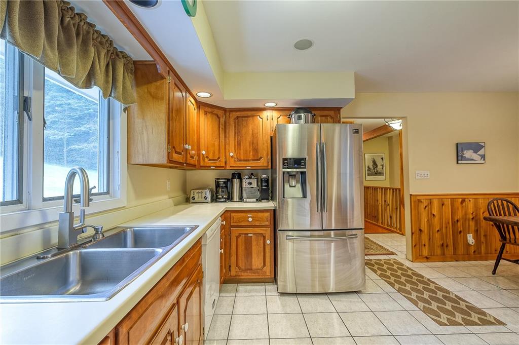 282 Alpine Heights Road Champion, PA 15622 - Photo 9 of 25 a kitchen with stainless steel appliances granite countertop a refrigerator a sink and dishwasher