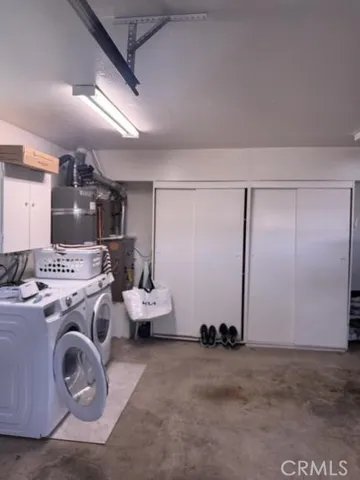 a view of a storage & utility room with washer and dryer