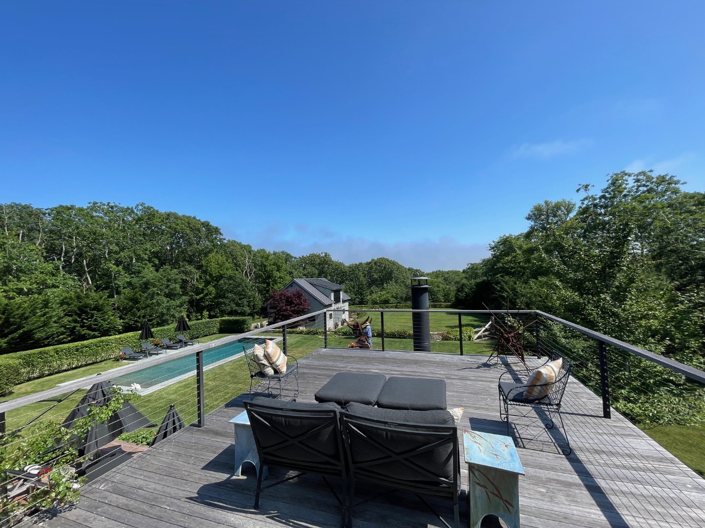 9 Ridge Hill Road Chilmark, MA 02535 - Photo 38 of 48 a view of a deck with wooden floor and outdoor seating