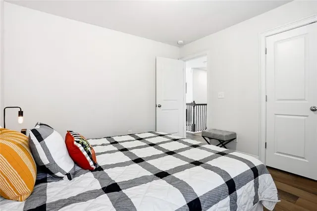 a bedroom with a bed and a closet