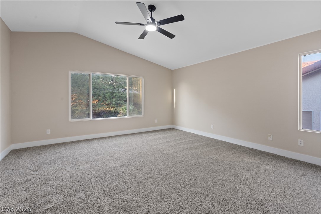 1662 Ravanusa Drive Henderson, NV 89052 - Photo 25 of 74 A quiet retreat with vaulted ceilings, featuring large windows and soft carpeting.
