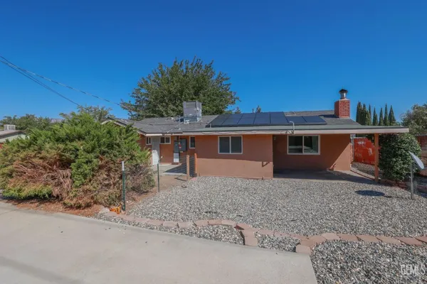 a view of a house with a sink and yard