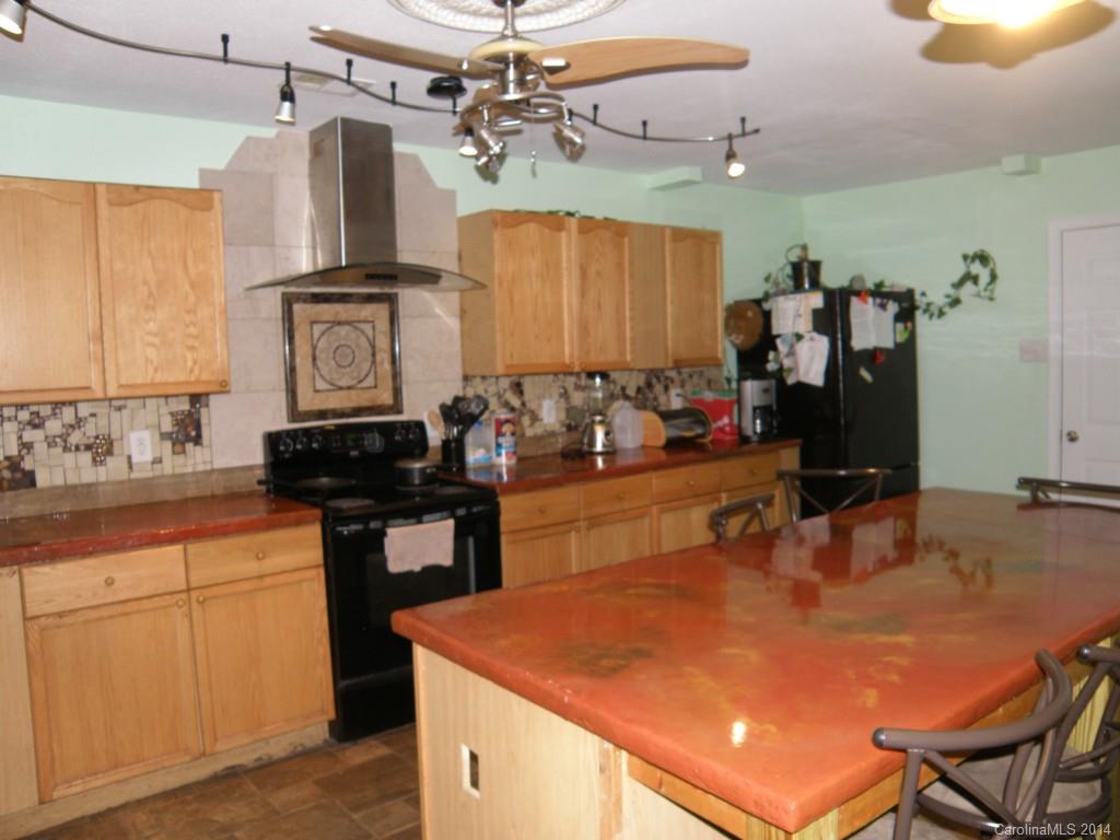 2300 Gooseberry Road Charlotte, NC 28208 - Photo 4 of 13 a kitchen with stainless steel appliances granite countertop a sink and cabinets