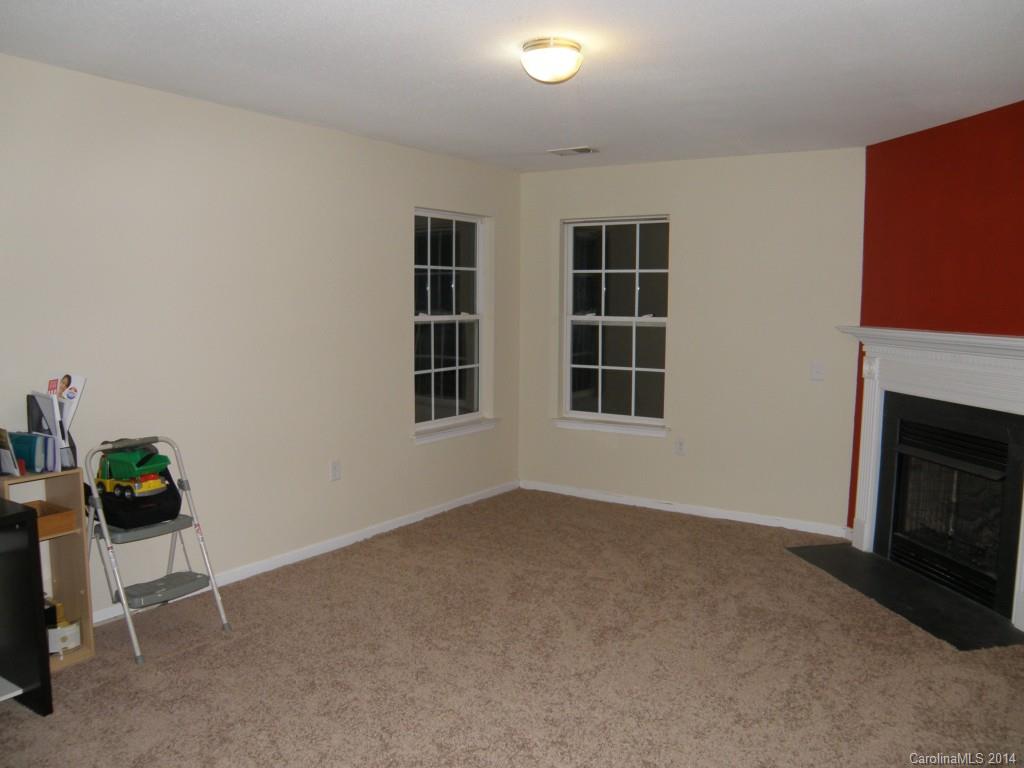 2300 Gooseberry Road Charlotte, NC 28208 - Photo 8 of 13 a view of empty room with windows and fireplace
