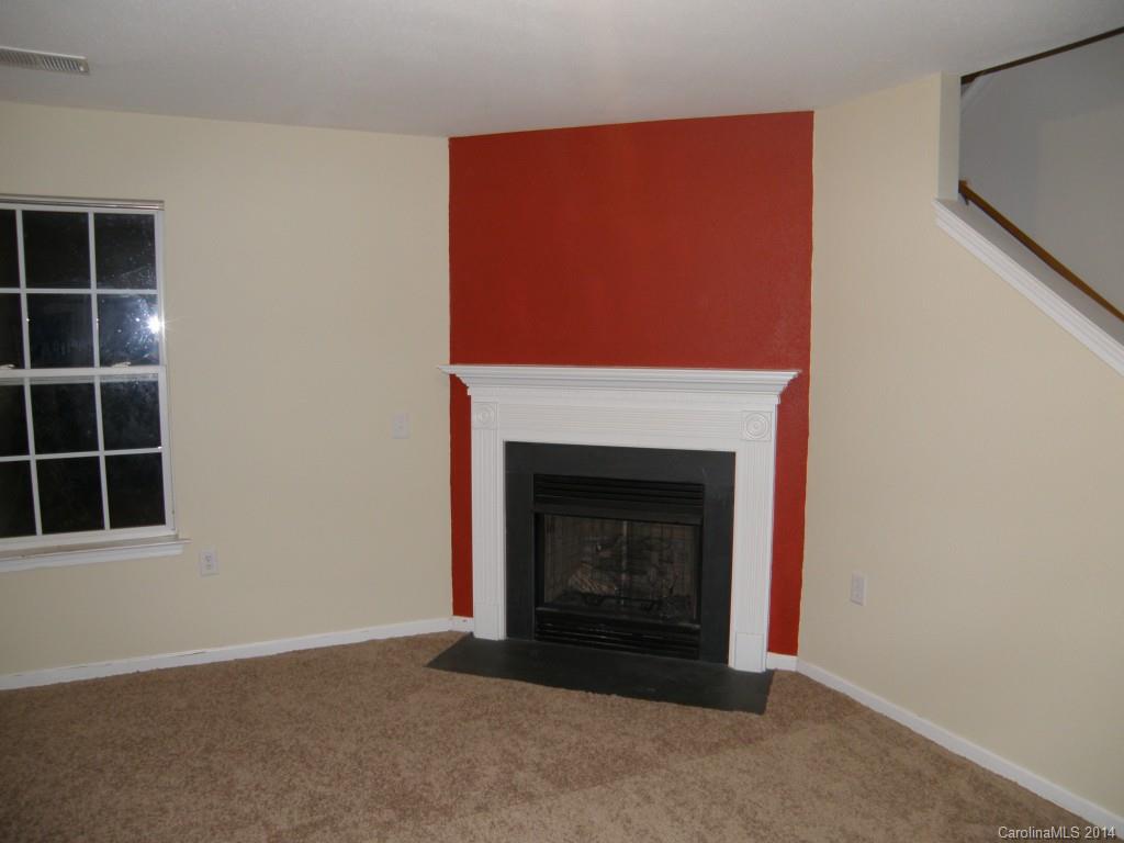 2300 Gooseberry Road Charlotte, NC 28208 - Photo 9 of 13 a living room with a fireplace