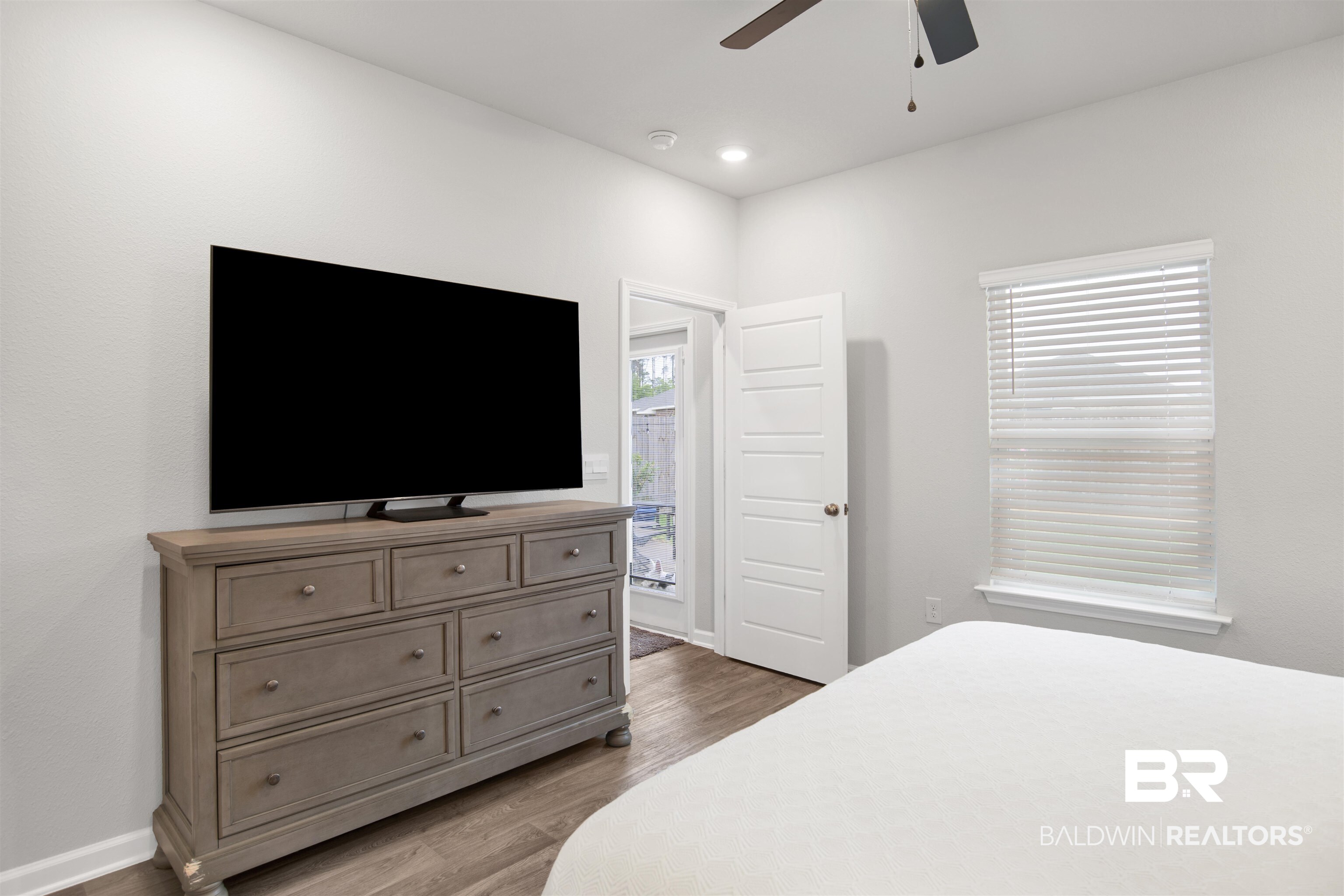 12813 Patriot Way Daphne, AL 36527 - Photo 10 of 23 Bright interior space featuring wood-finish flooring, recessed lighting, and a ceiling fan
