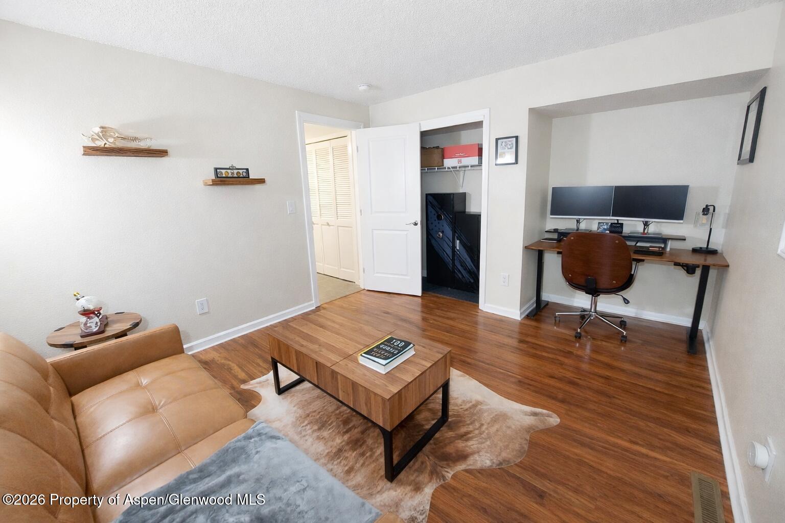 1310 Dogwood Drive Rifle, CO 81650 - Photo 32 of 49 a living room with furniture and a wooden floor