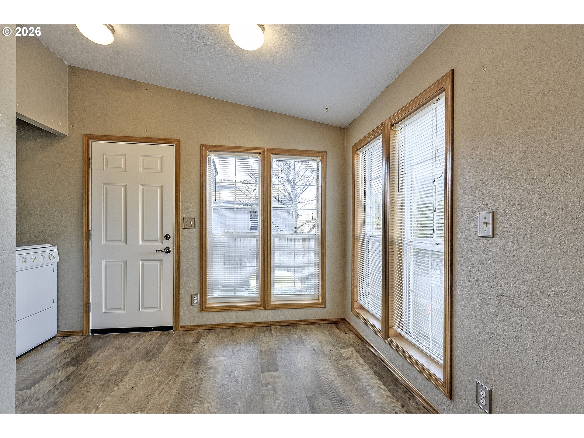 5385 Southwest 167th Avenue Beaverton, OR 97007 - Photo 15 of 29 a view interior of a house with wooden floor and windows