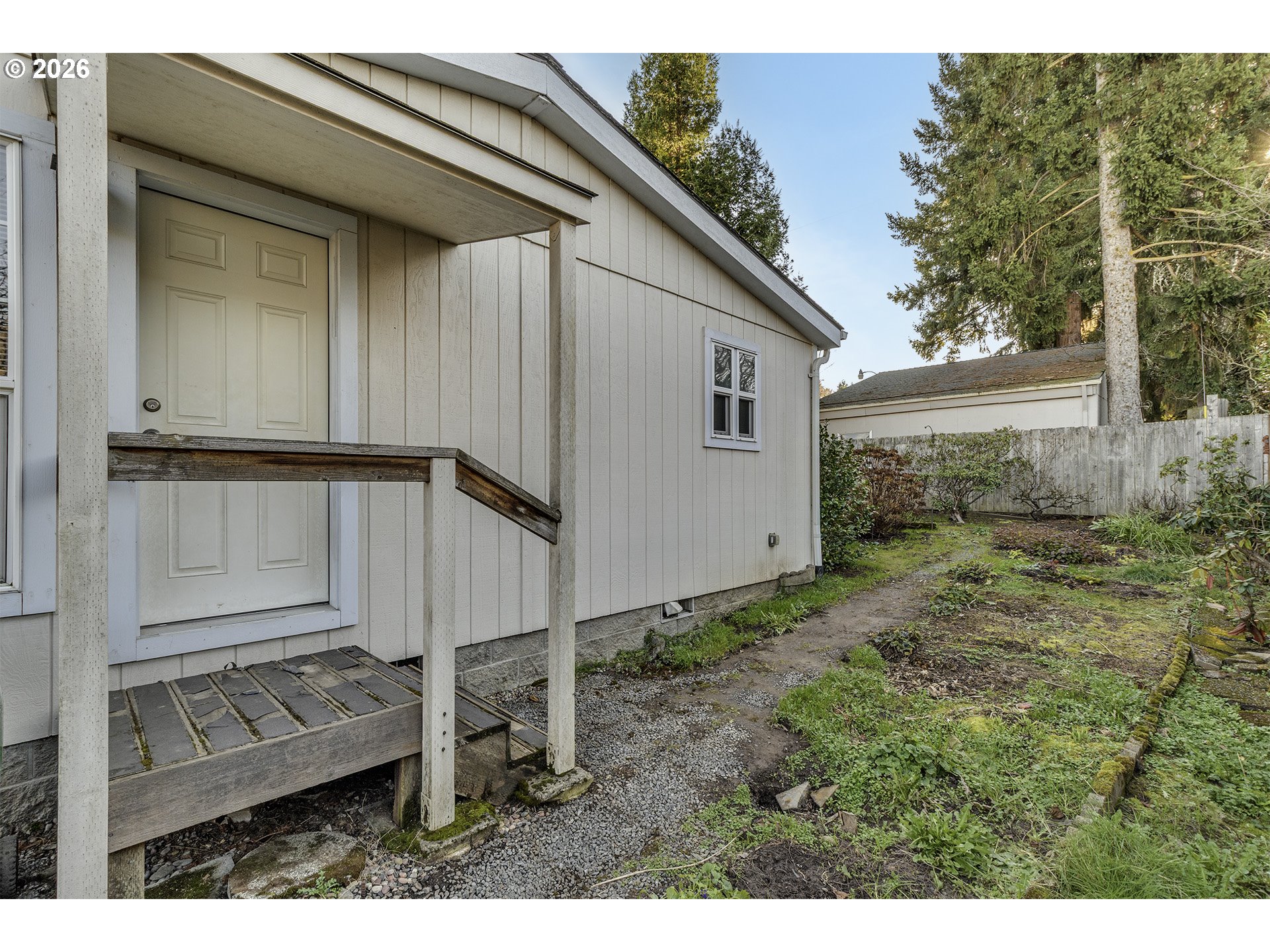 5385 Southwest 167th Avenue Beaverton, OR 97007 - Photo 24 of 29 a view of backyard with small cabin and wooden fence