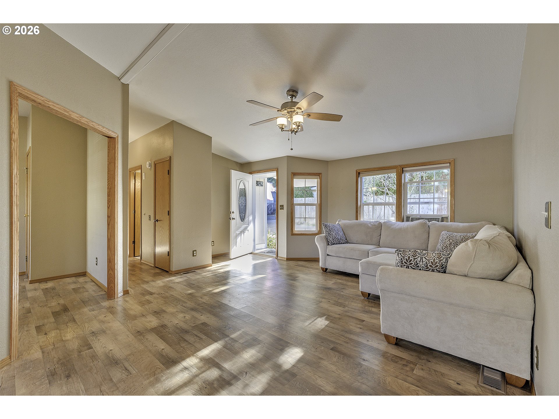 5385 Southwest 167th Avenue Beaverton, OR 97007 - Photo 28 of 29 a living room with furniture and a chandelier