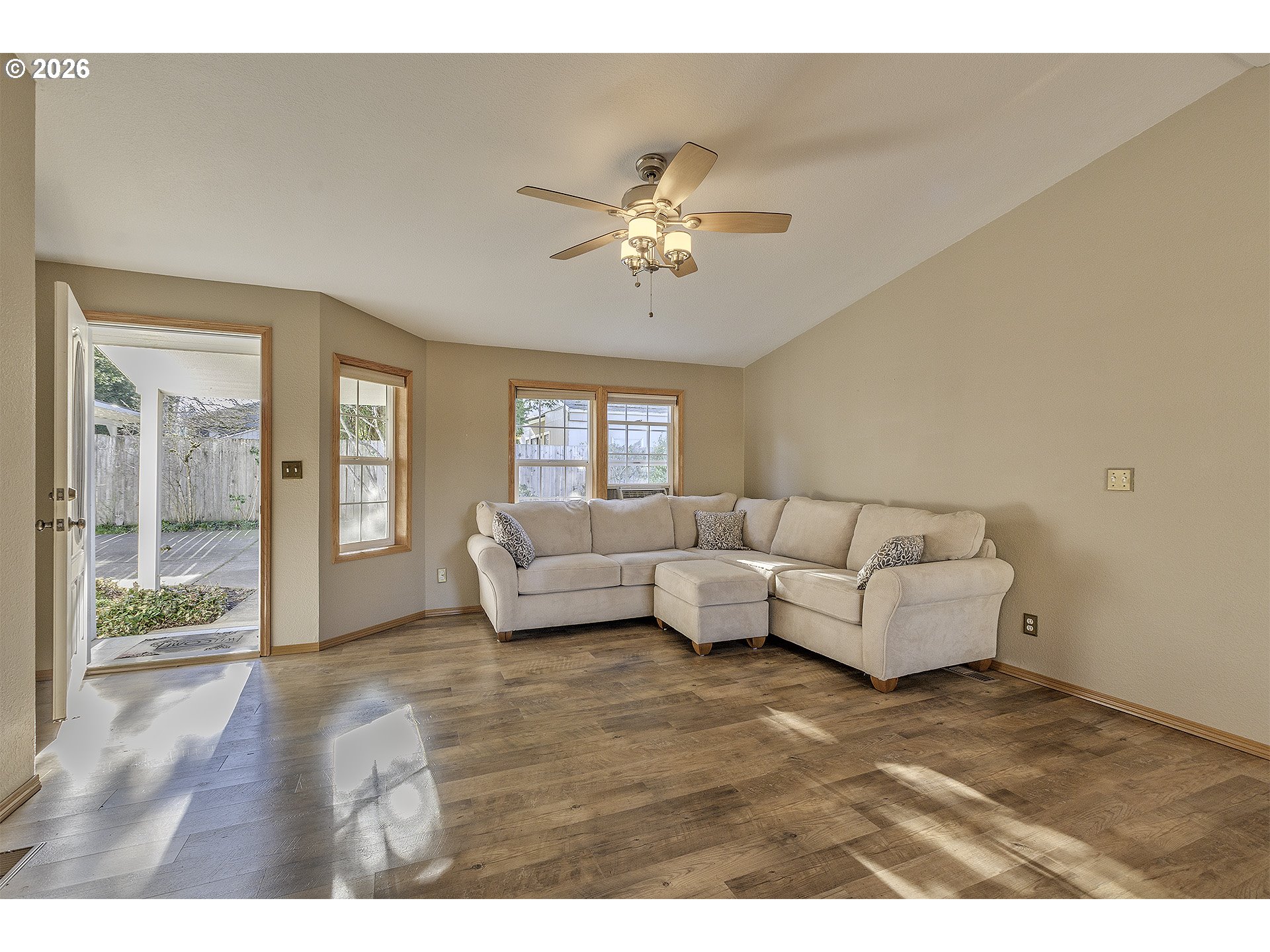 5385 Southwest 167th Avenue Beaverton, OR 97007 - Photo 5 of 29 a living room with furniture and a large window with balcony view