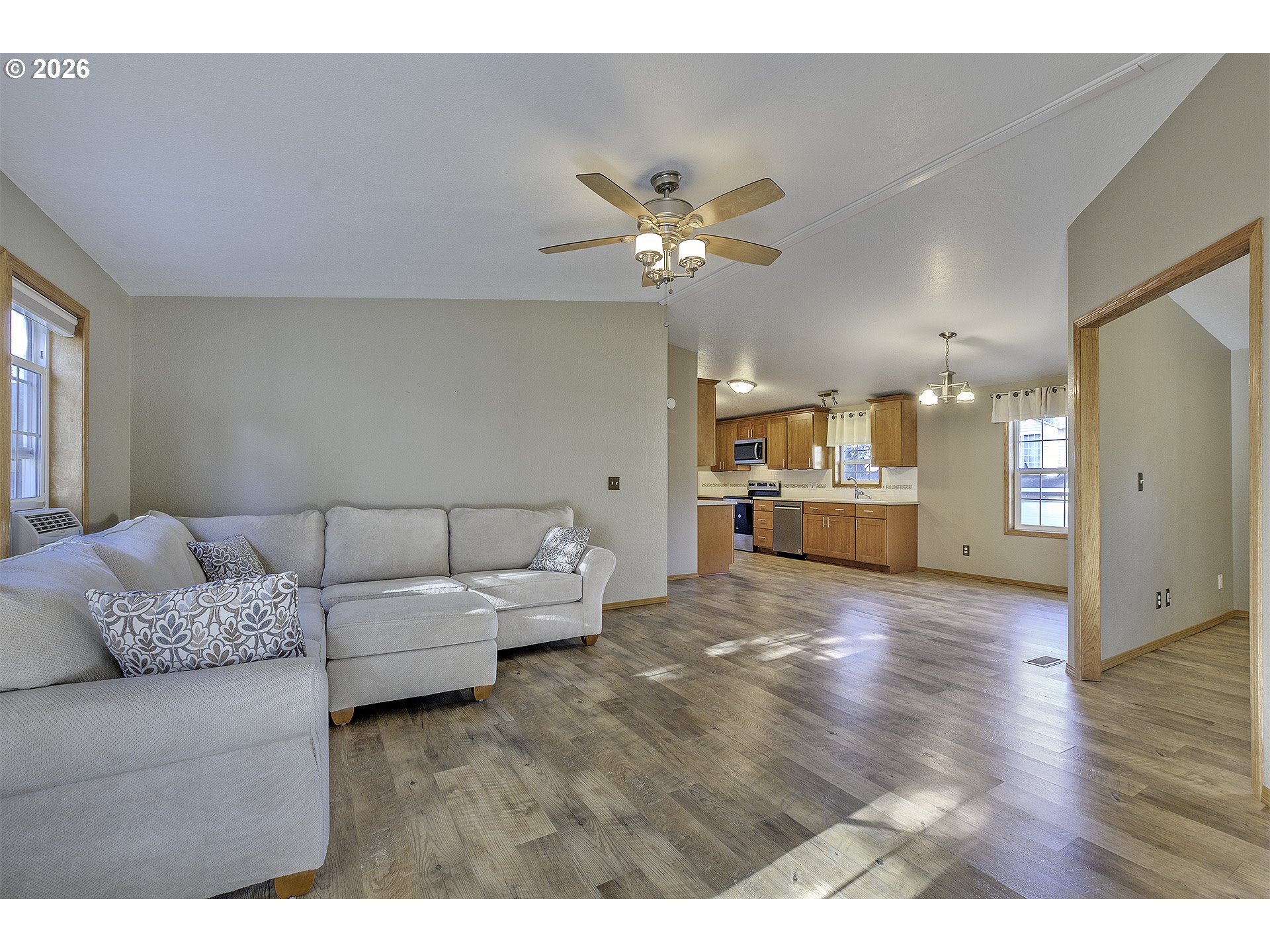 5385 Southwest 167th Avenue Beaverton, OR 97007 - Photo 6 of 29 a living room with furniture and kitchen view