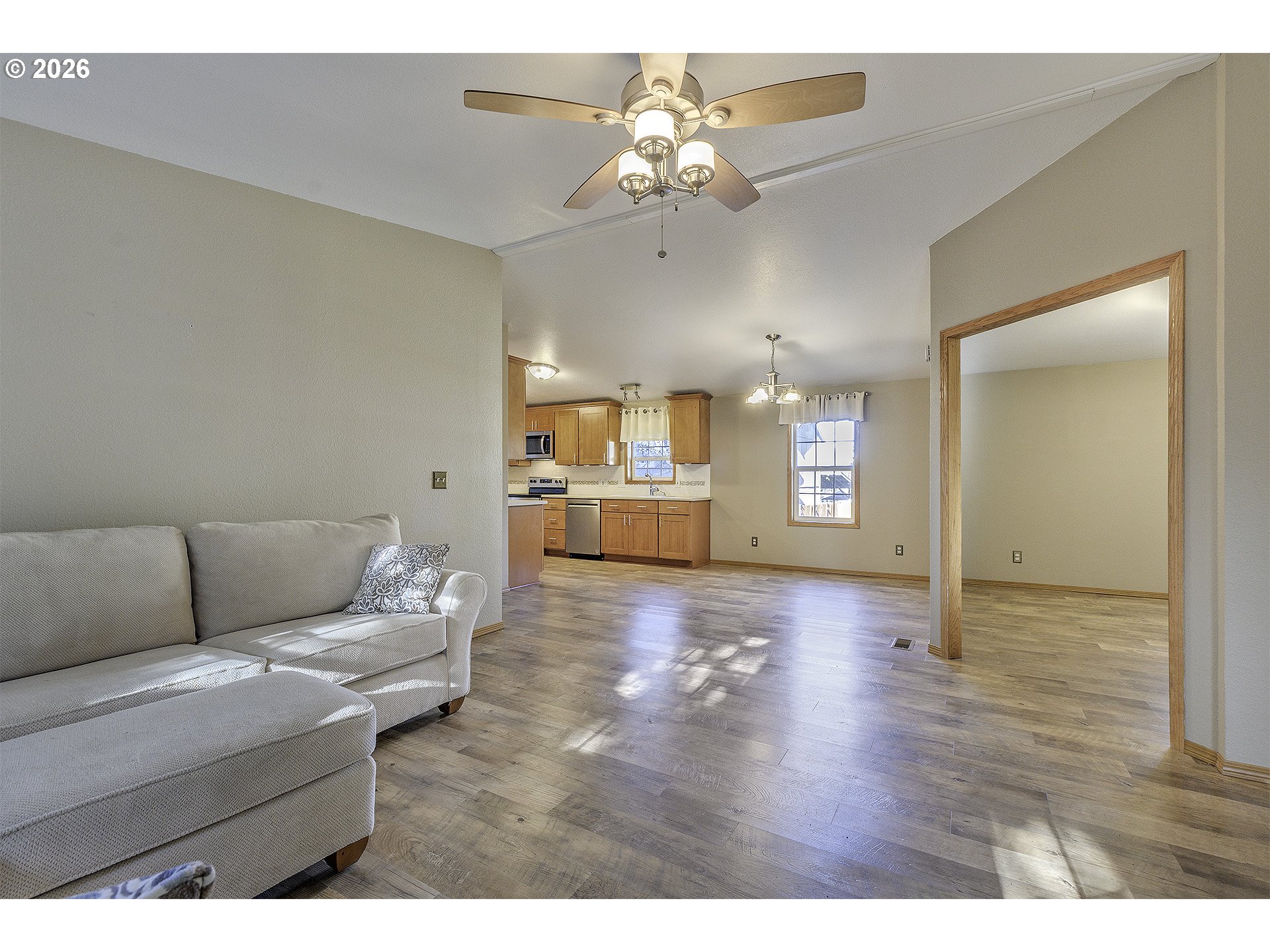5385 Southwest 167th Avenue Beaverton, OR 97007 - Photo 7 of 29 a living room with furniture and a chandelier