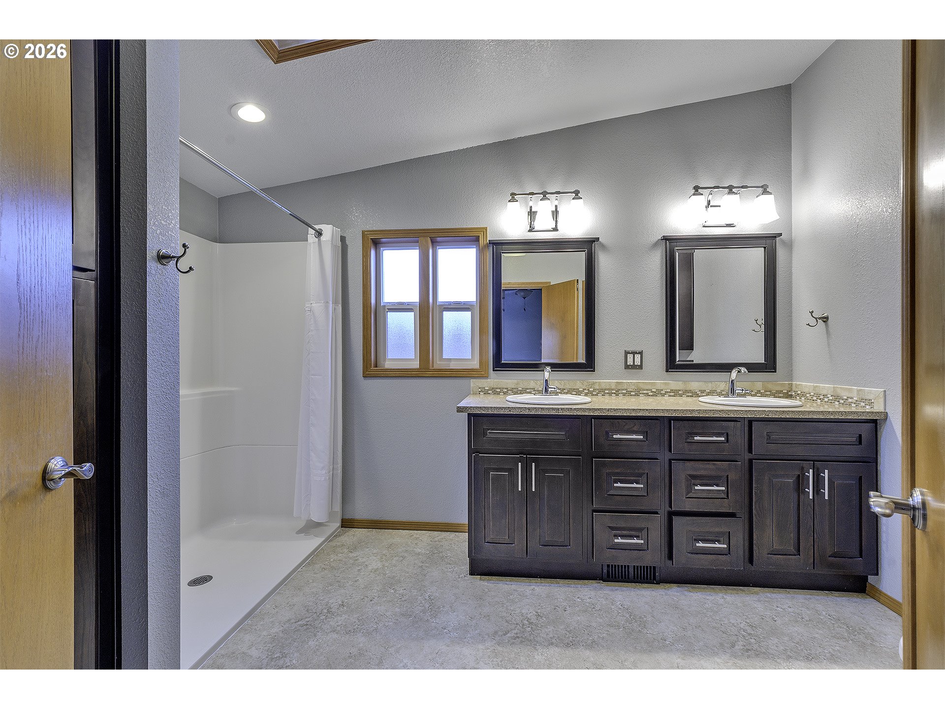 5385 Southwest 167th Avenue Beaverton, OR 97007 - Photo 10 of 29 a bathroom with a sink and a large mirror