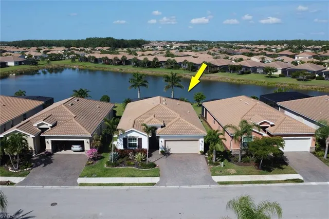 an aerial view of multiple houses with outdoor space
