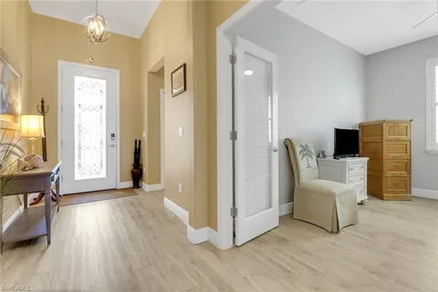 a view of a livingroom with furniture and a flat screen tv